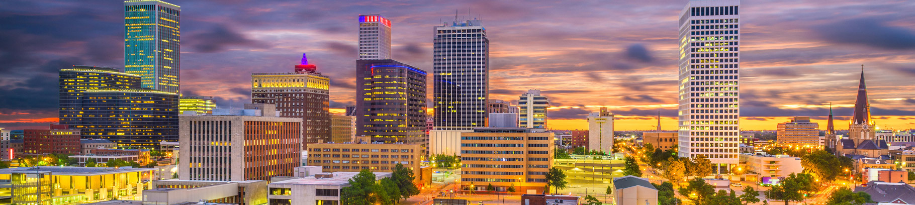 A view of Tulsa's downtown skyline at sunset